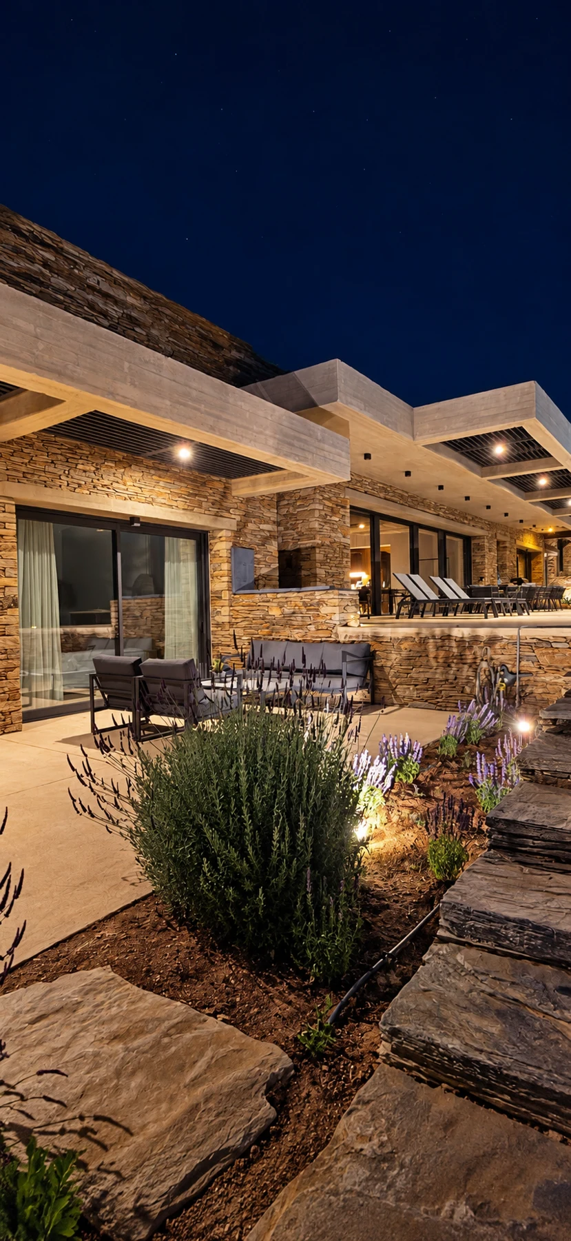 Androsthea villa exterior illuminated in the evening