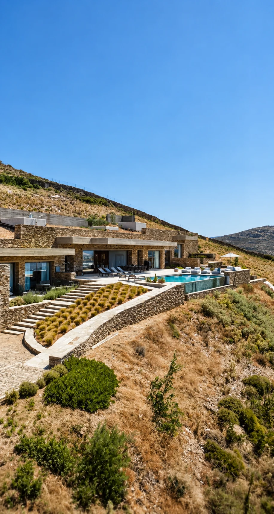 Exterior of Androsthea villa set into the hillside above Kypri on Andros